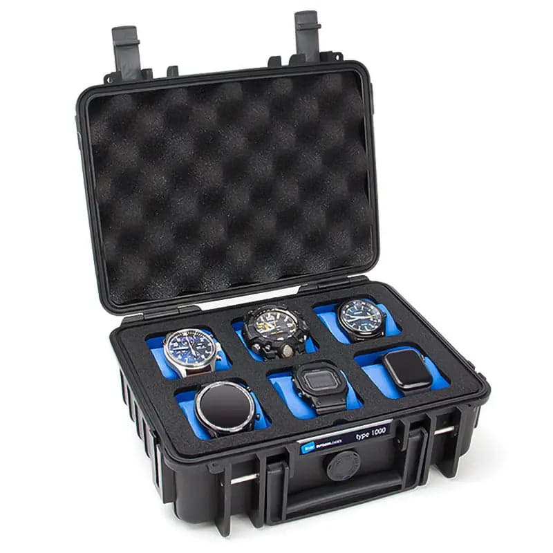 Mallette de voyage noire pour montres, ouverte, avec ses coussins de maintien